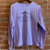Front of women's long sleeve crew neck shirt in the colorway Pastel Lilac (light purple). "Montana, The Last Best Place." is printed in dark purple ink with white mountains.