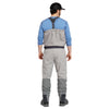 man showing back of orvis ultralight convertible waders