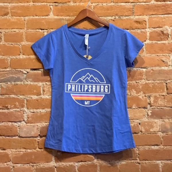 Front of women's v-neck t-shirt in the colorway Royal Heather (bright blue). The logo "Philipsburg Mt" is printed in white with mountains. There is a rainbow strip between Philipsburg and Mt.