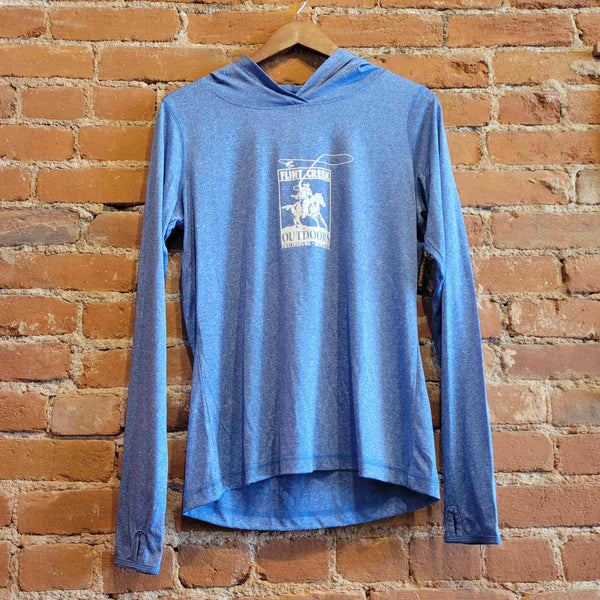 Picture of the women's sun hoody front in the colorway Santorini Blue Heather. There is a white print of the Flint Creek Outdoors Logo of a cowboy on a horse fly-fishing on the front. 
