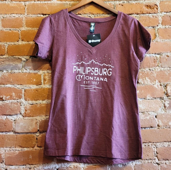 Front of the Ouray women's v neck t-shirt in the colorway Maroon Heather (maroon).  The logo "Philipsburg Montana EST. 1867" is printed in white under starry mountains.